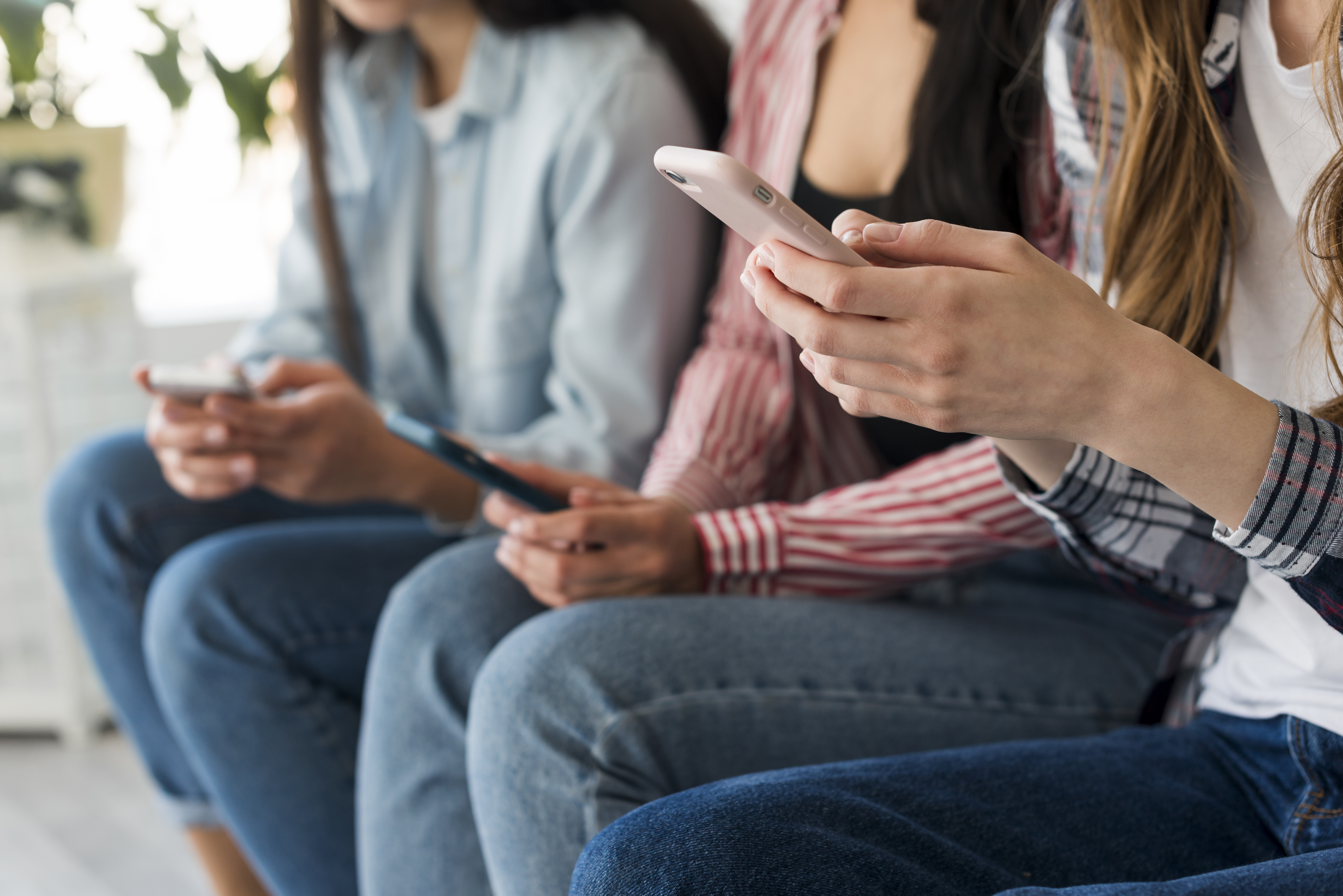 close-up-ladies-hands-holding-phones